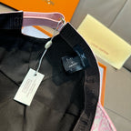 Louis Vuitton cap strap detail with black lining and attached tags