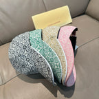 Set of Louis Vuitton monogram-pattern caps in gray, green, beige, and pink