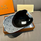 Monogram-pattern baseball cap with black inner lining, interior view with tags.