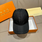 Louis Vuitton dark baseball cap with adjustable back strap and stitched crown panels.