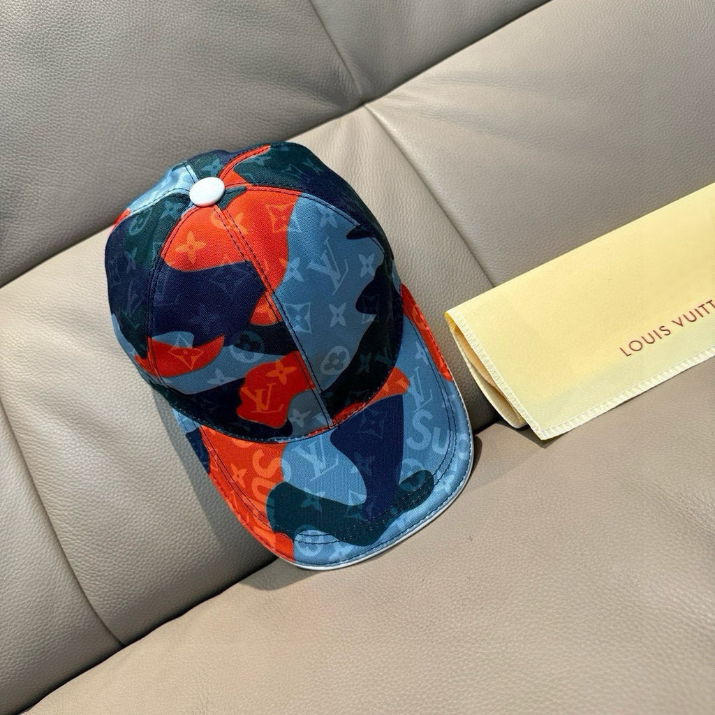 Patchwork baseball cap, side view, dark blue and light blue with orange accents