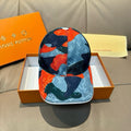 Patchwork baseball cap in dark blue, light blue, and orange logo print