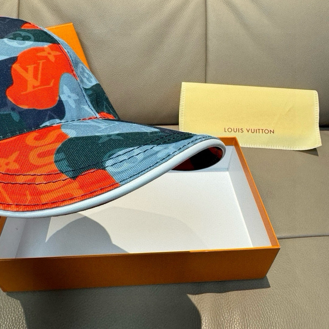 Patchwork baseball cap brim close-up in blue and orange with logo pattern