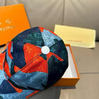 Patchwork baseball cap with round button top, blue and orange logo patchwork