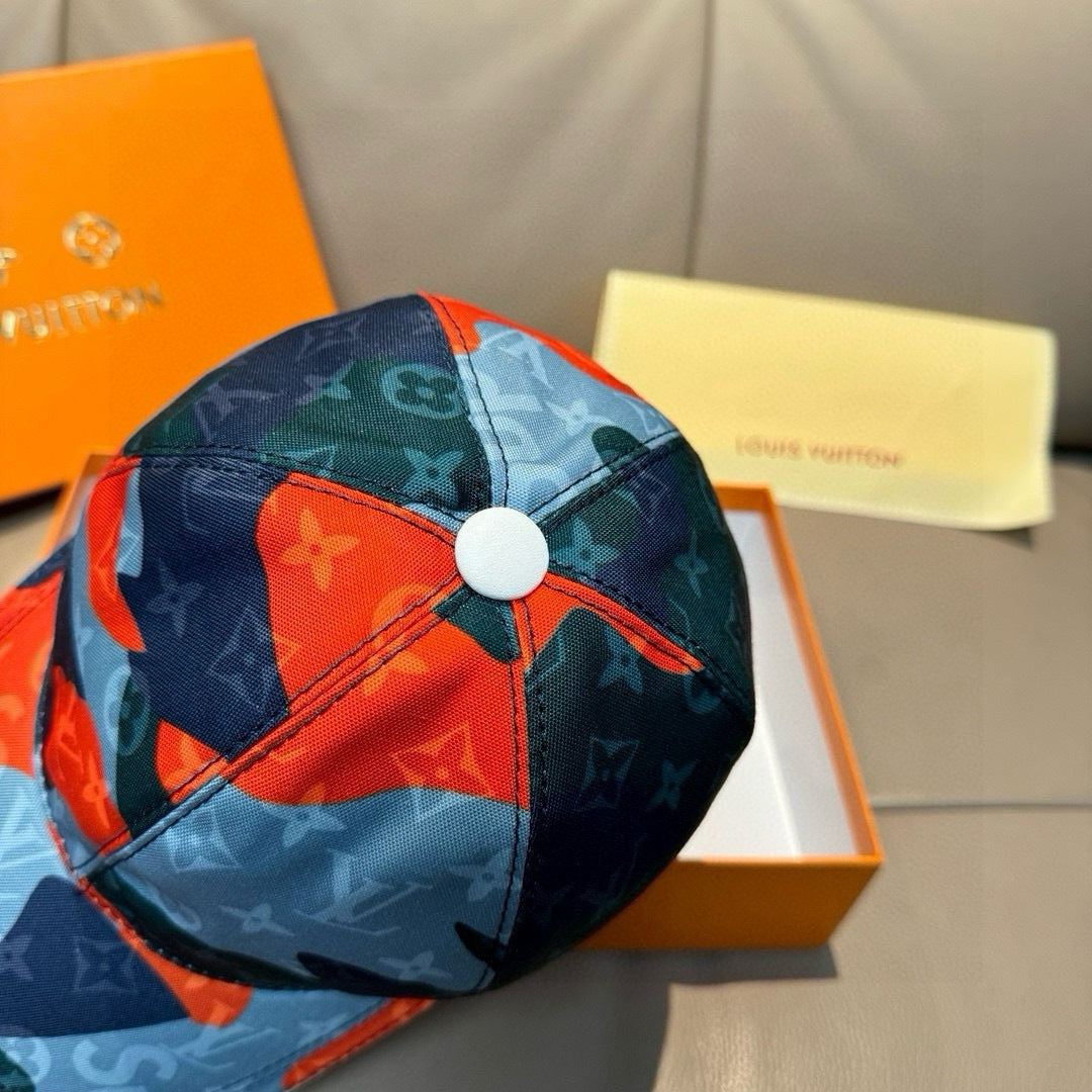 Patchwork baseball cap with round button top, blue and orange logo patchwork