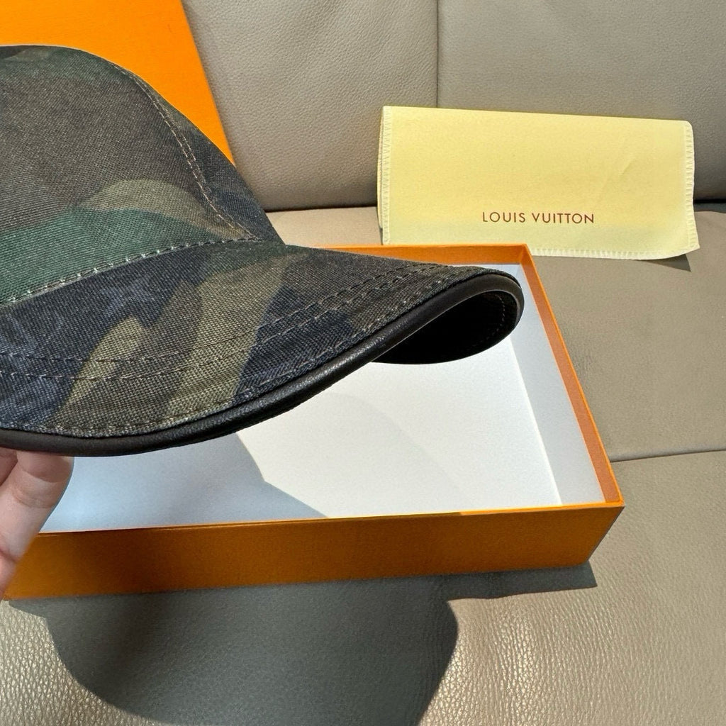 Camouflage baseball cap brim close-up with black underside lining