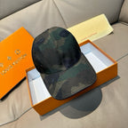 Dark green camouflage baseball cap with curved brim and top button