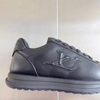 Black leather sneaker with lace-up vamp and embossed side LV-style emblem