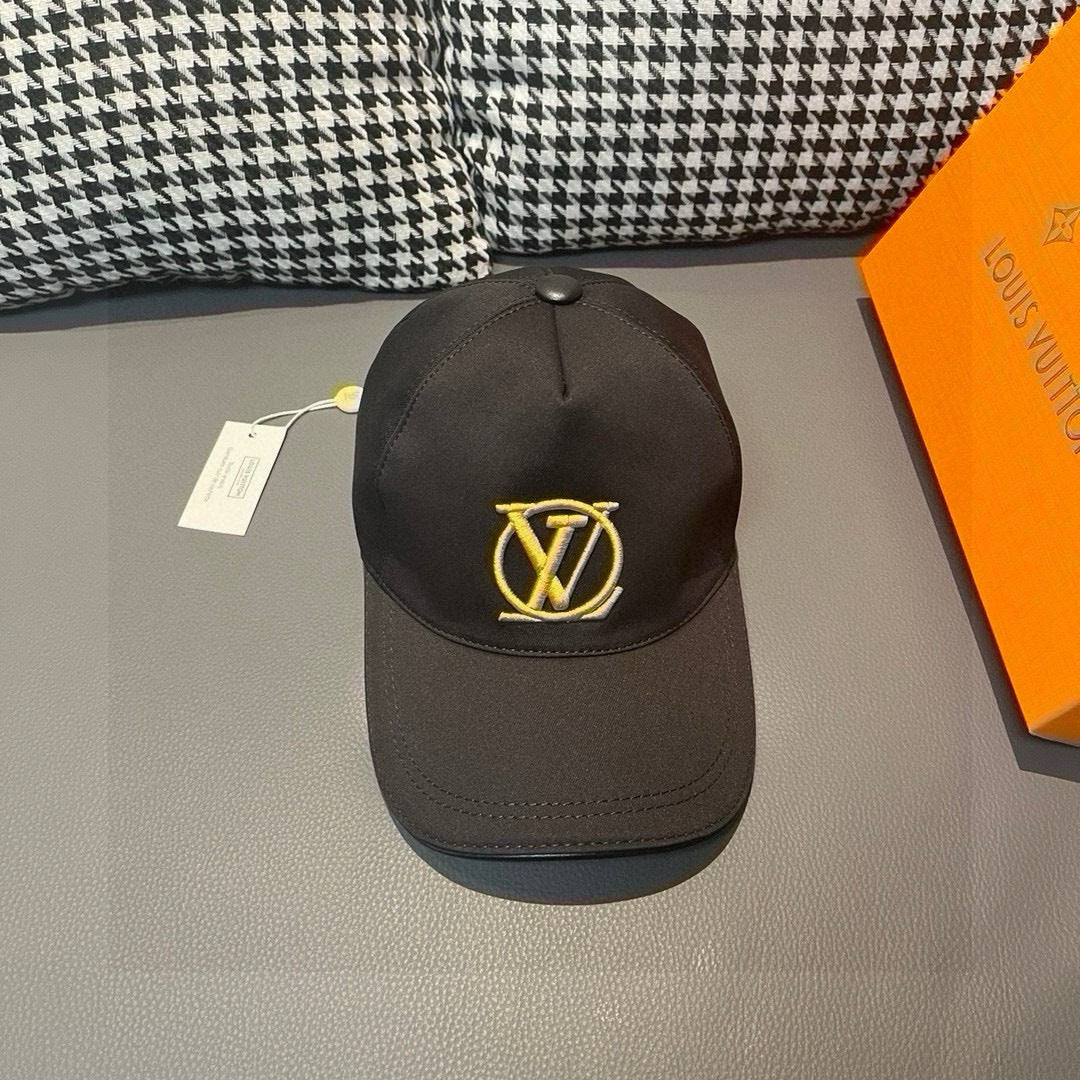 Black Louis Vuitton baseball cap with gold LV monogram on front, curved brim