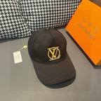 Black Louis Vuitton baseball cap with gold LV monogram logo, curved brim