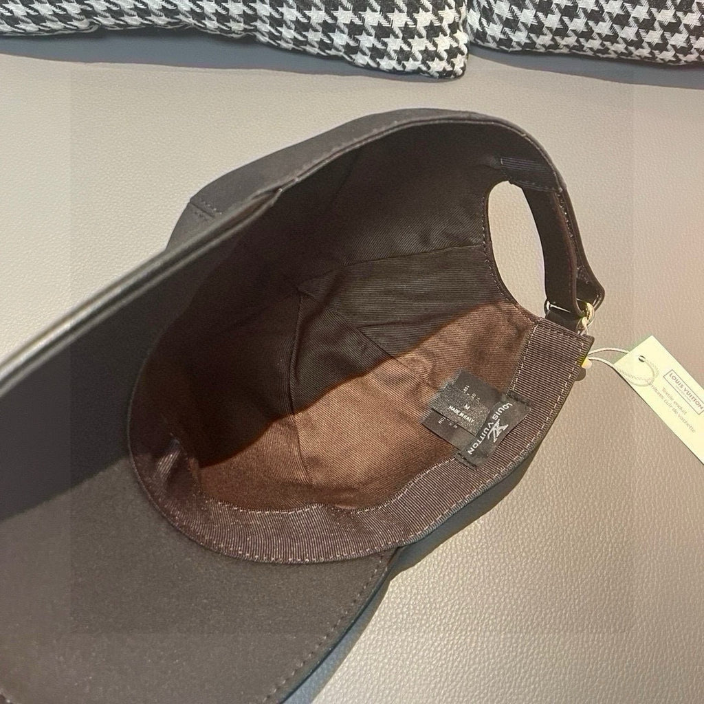 Black Louis Vuitton cap interior lining with visible size and brand tags