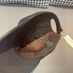Black Louis Vuitton cap interior lining with visible size and brand tags