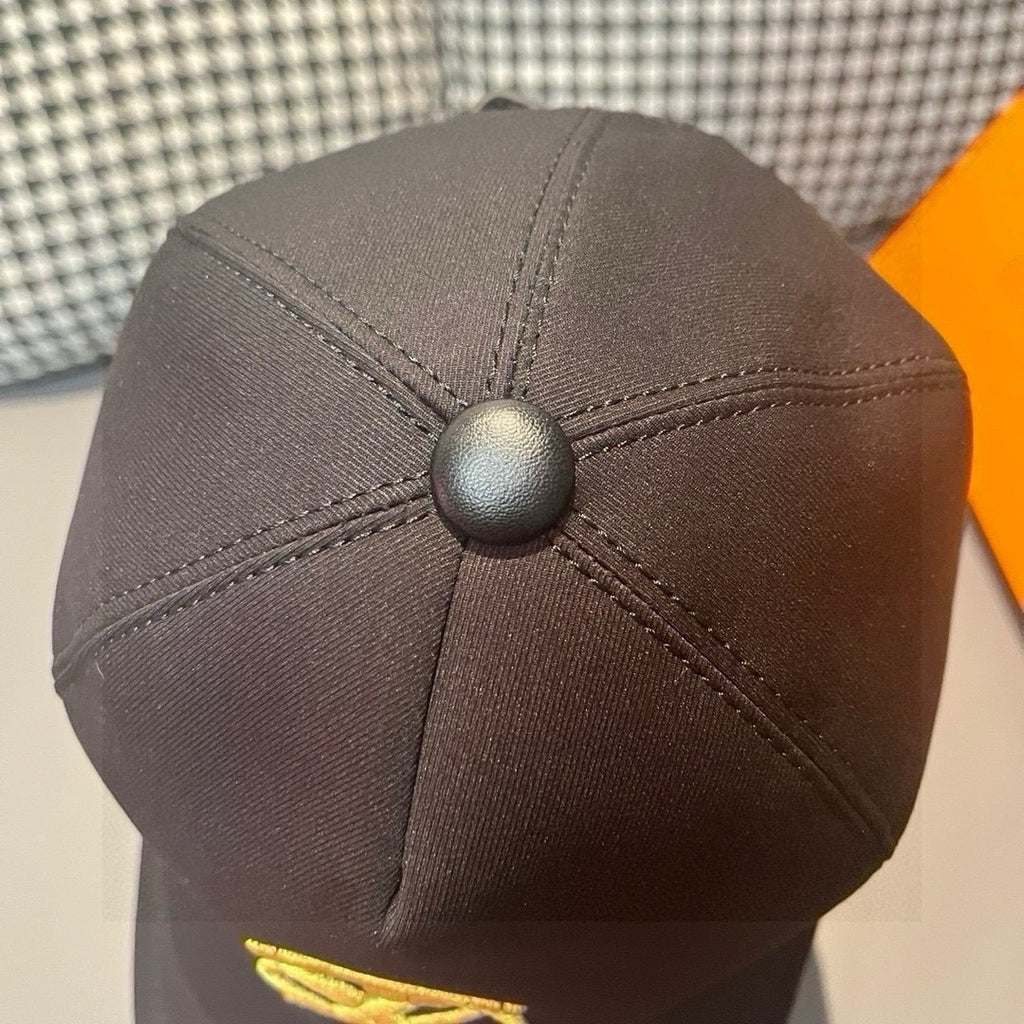 Black Louis Vuitton cap back panel with round button and stitched seams