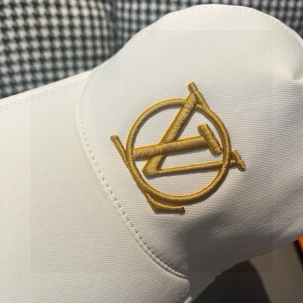 Louis Vuitton cap, white with close-up gold LV embroidered logo