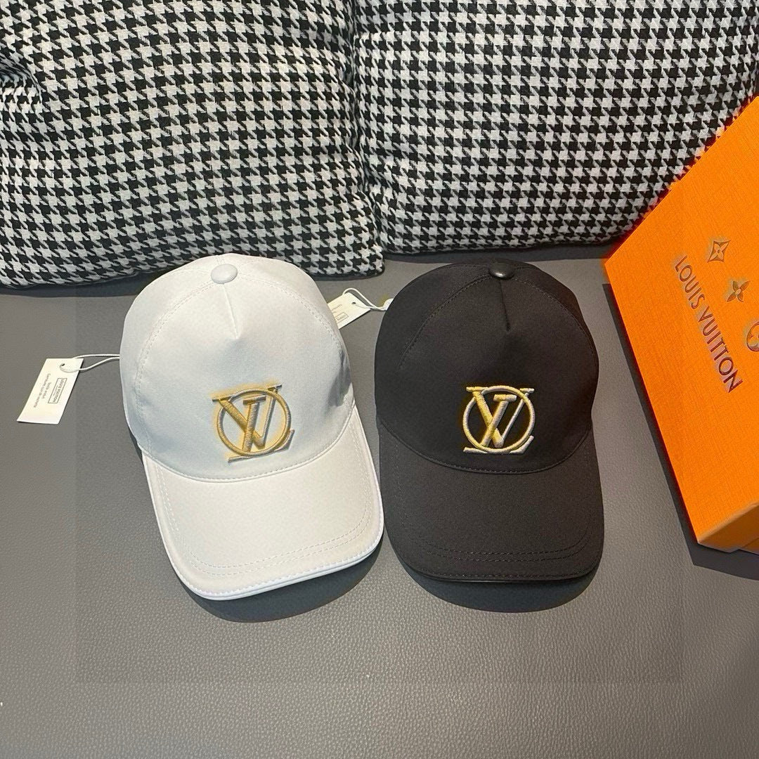 Louis Vuitton caps, white and black with gold LV emblems