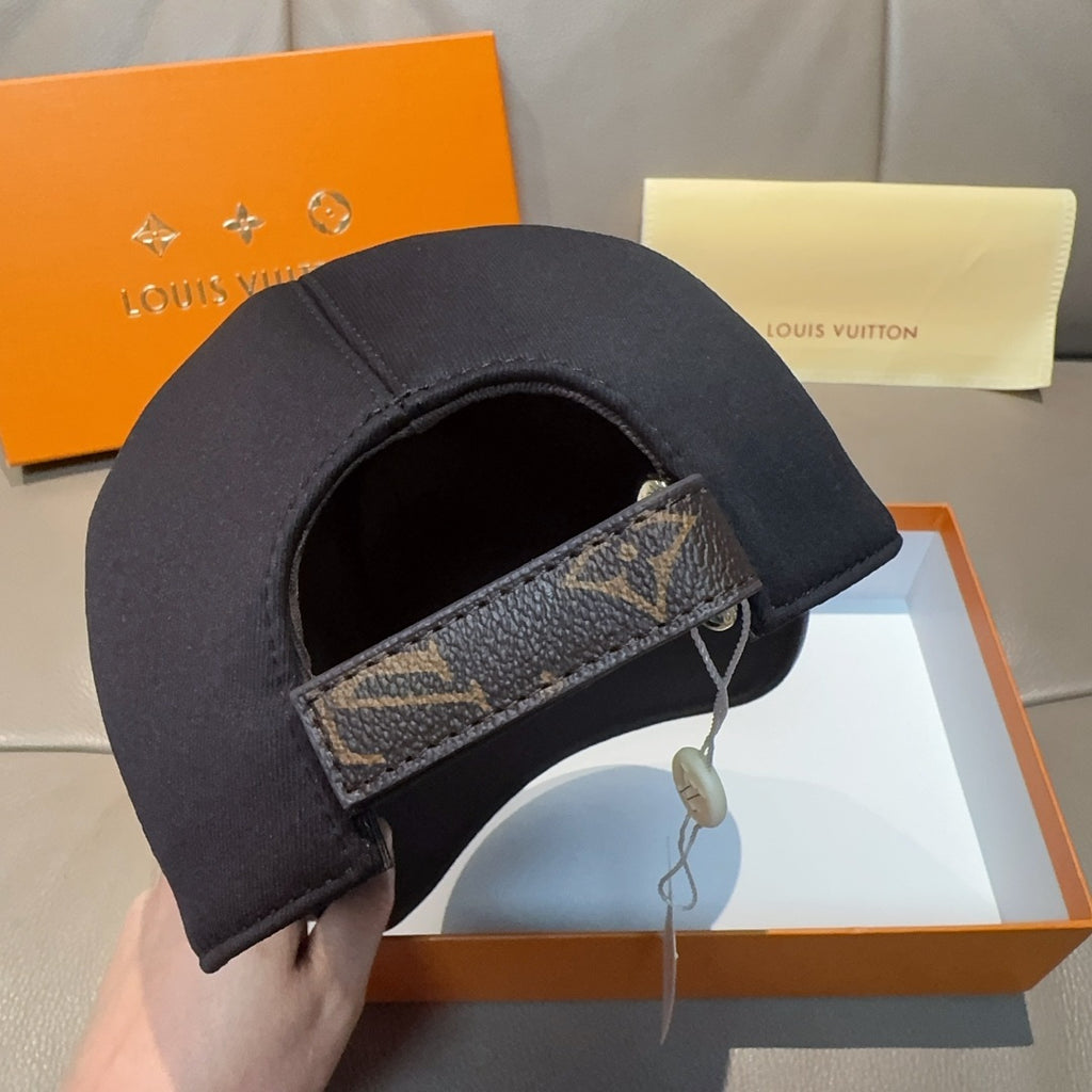 Louis Vuitton baseball cap with dark crown and monogram-pattern strap detail on side