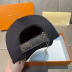 Louis Vuitton baseball cap with dark crown and monogram-pattern strap detail on side