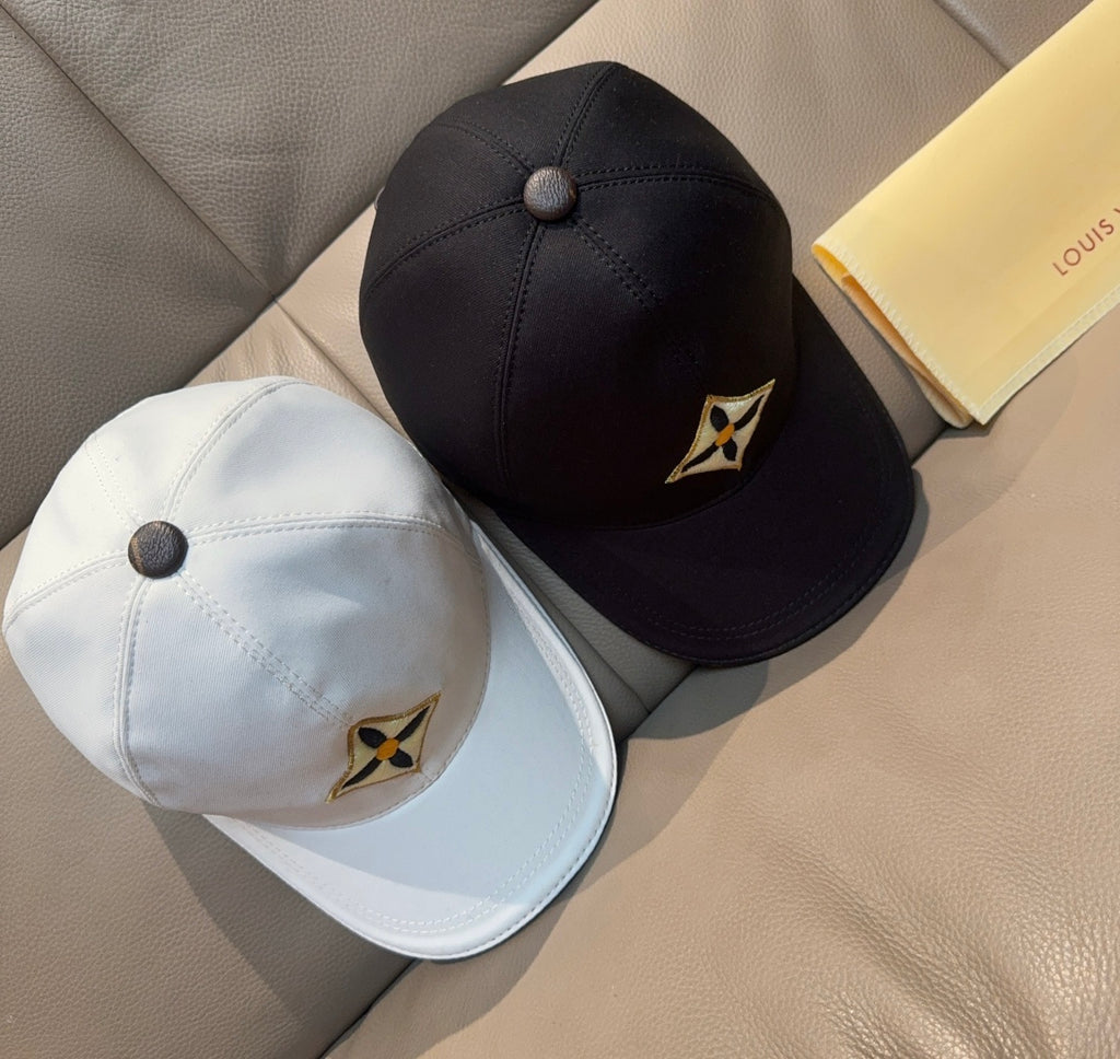 White and black baseball caps with round button tops and small star logos.