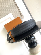 Louis Vuitton crossbody bag in dark leather with top zipper and gold hardware