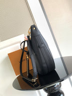 Louis Vuitton shoulder bag in dark leather with textured finish and gold clasp detail
