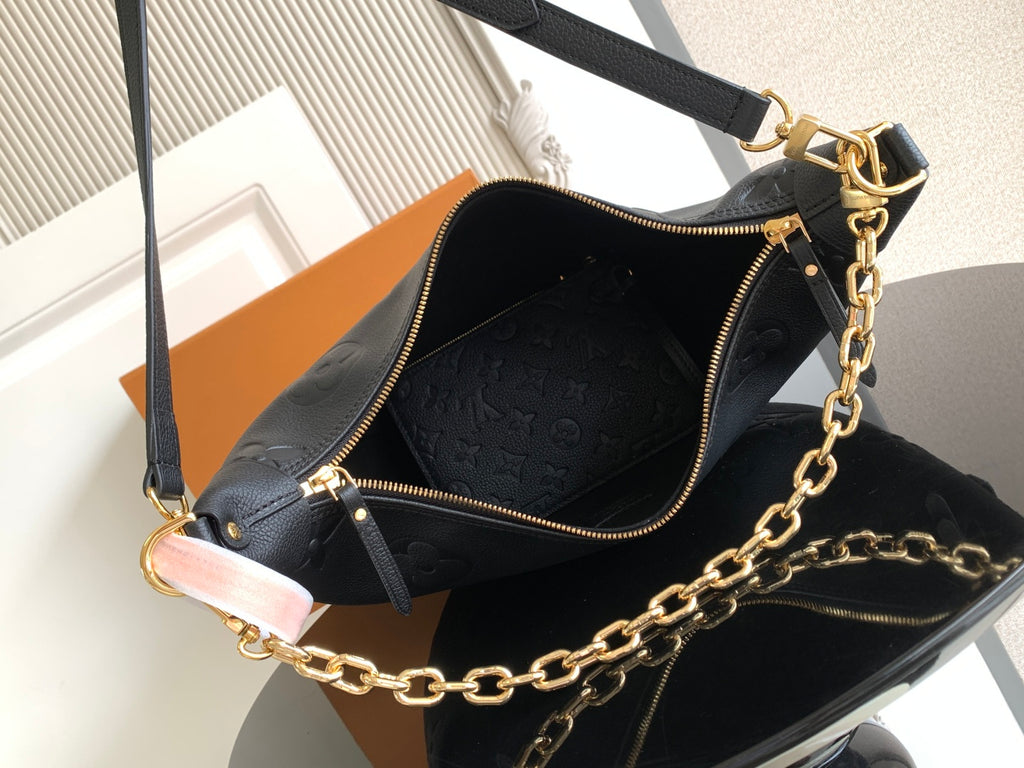 Louis Vuitton crossbody bag open view with zipper top, dark interior, and chain strap