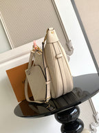 Louis Vuitton shoulder bag in light beige with textured monogram and adjustable strap