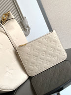 Louis Vuitton small shoulder bag in light beige with embossed monogram and gold chain