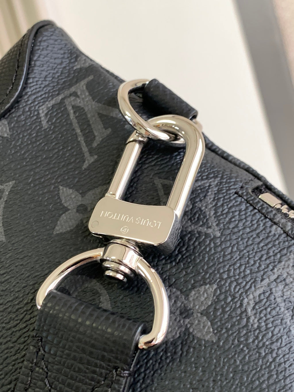 Louis Vuitton monogram bag hardware with D-ring, swivel clasp, and attachment ring