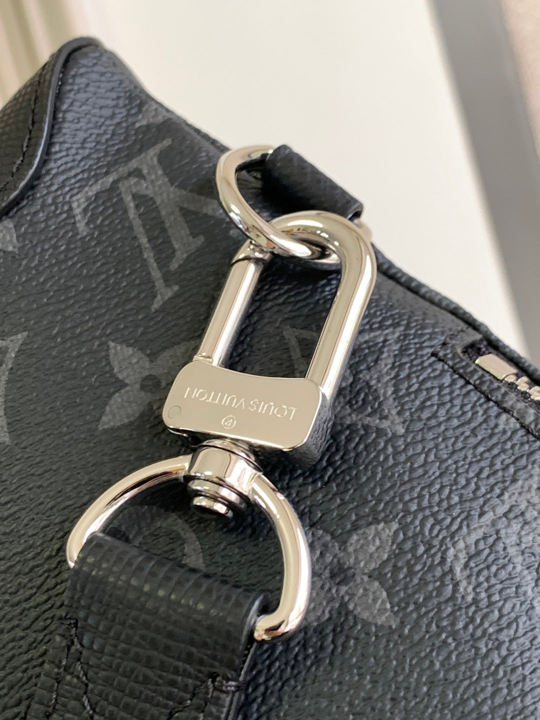 Louis Vuitton monogram bag hardware with D-ring, swivel clasp, and attachment ring