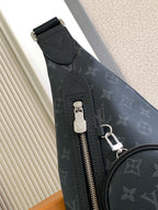 Louis Vuitton monogram crossbody bag with top zipper, keyring clip, and pull tab
