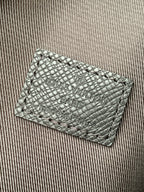 Louis Vuitton embossed leather card holder with logo text