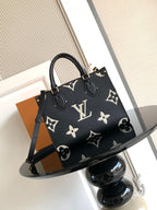 Louis Vuitton tote bag in dark navy with monogram print, dual handles and shoulder strap