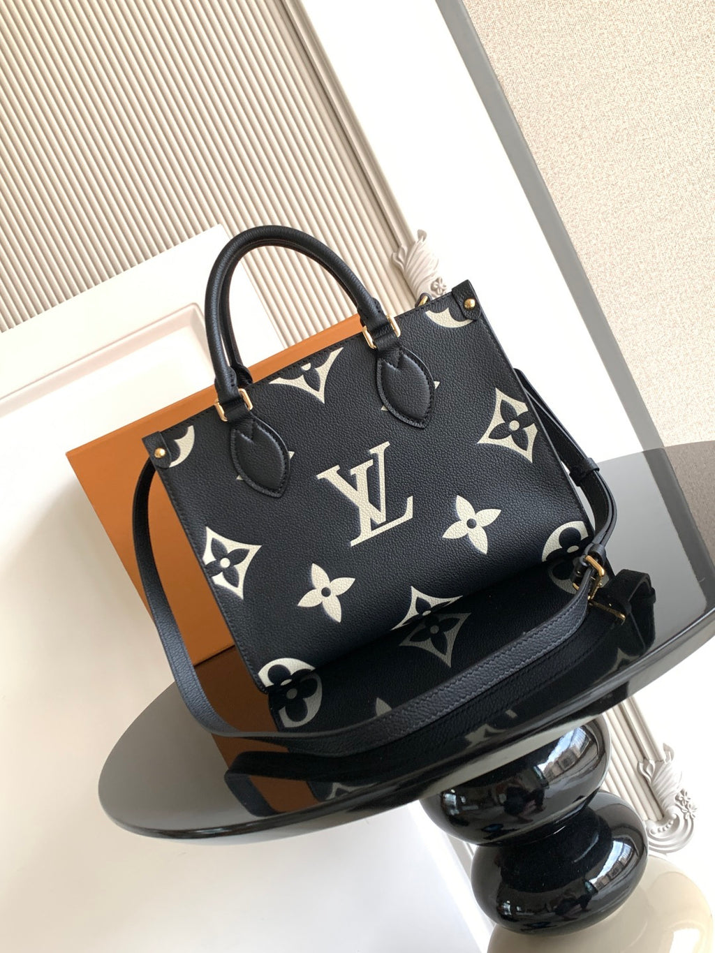 Louis Vuitton tote bag in dark navy monogram pattern with handles and shoulder strap