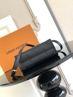 Black textured leather crossbody mini bag with gold-tone hardware