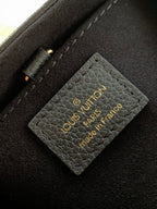 Black interior card slot with Louis Vuitton Paris France text label