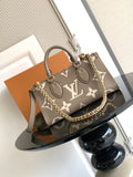 Louis Vuitton monogram tote handbag with gray-brown canvas, top handles and chain strap
