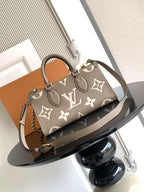 Louis Vuitton monogram handbag with gray-brown canvas, chain strap and leather trim