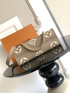 Monogram handbag in gray-brown canvas with chain shoulder strap and leather top