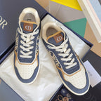 Unisex sneakers in dark blue denim with white sole and tan/gold logo panel