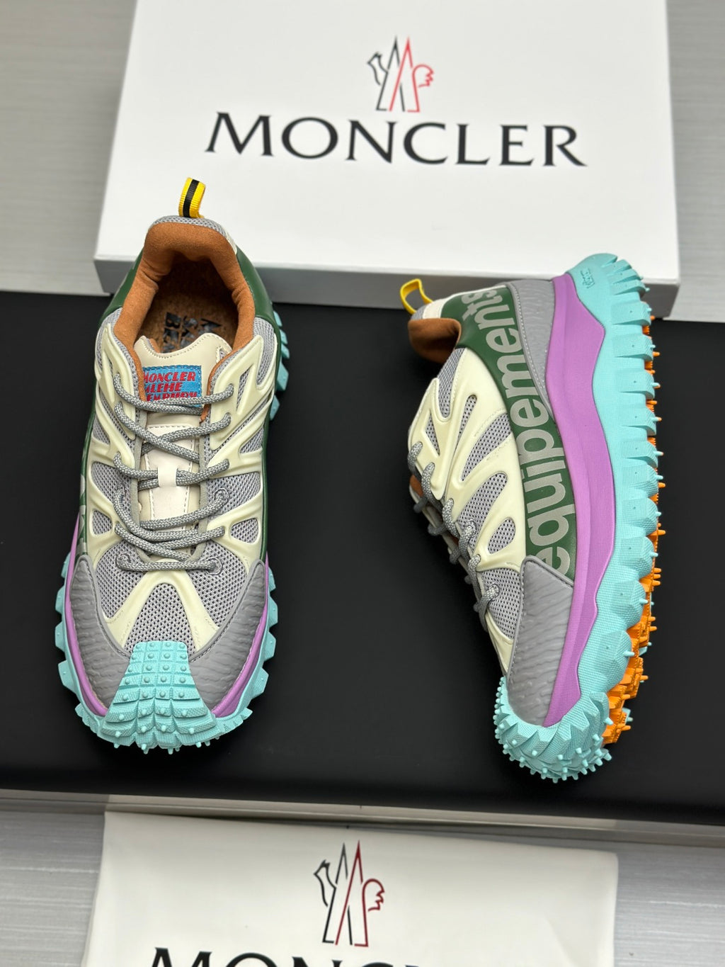 Two-tone grey sneakers with mint chunky sole and purple heel stripe, side view.