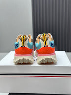 Moncler trail sneakers from the back, teal and beige uppers with orange heel panels