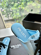 Prada women's light blue sneaker showing branded insole and black lace detail