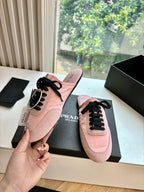 Prada lace-up sneakers for women, pink suede shoe held up with matching pair in box