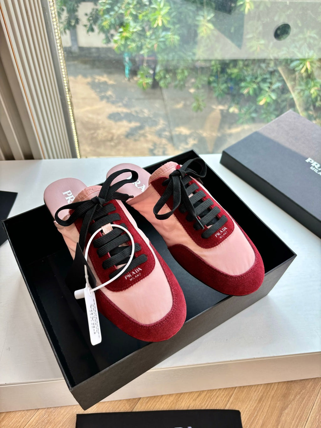 Prada women's sneakers, blush pink and burgundy with black laces