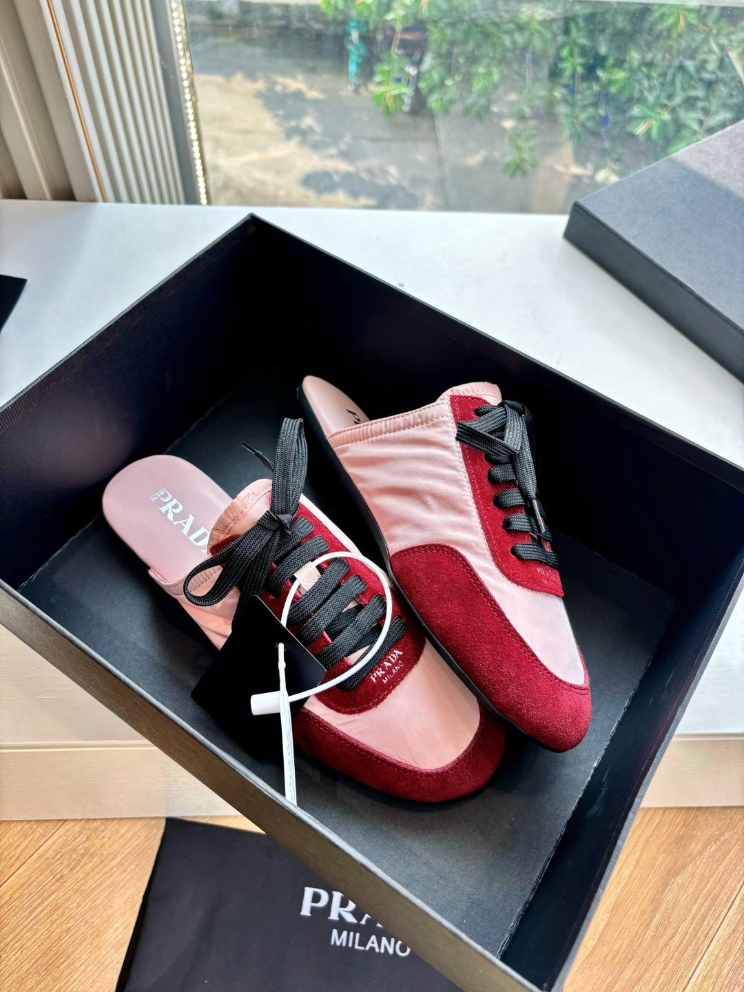 Prada women's sneakers in box, blush pink leather with burgundy suede and black laces
