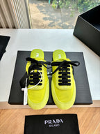 Neon yellow lace-up sneakers with black laces, padded collar, Prada MILANO text