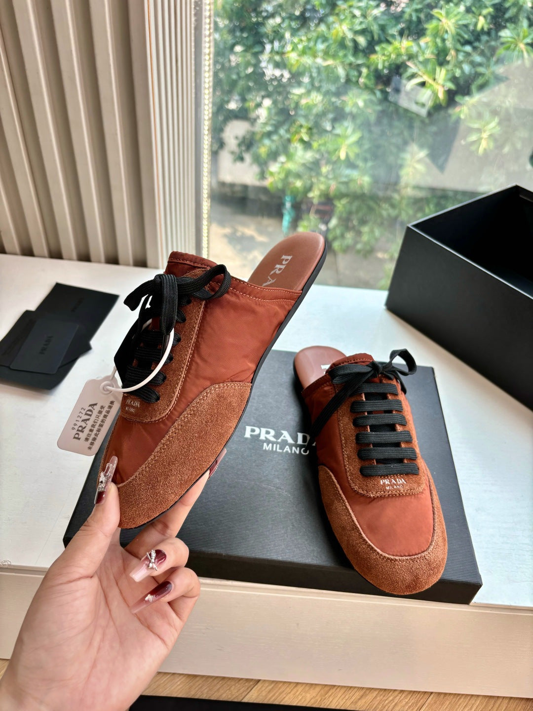 Prada low-top sneakers, tan leather upper with black laces and suede toe detail