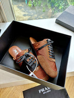 Prada low-top sneakers in tan suede with black laces and contrast stitching