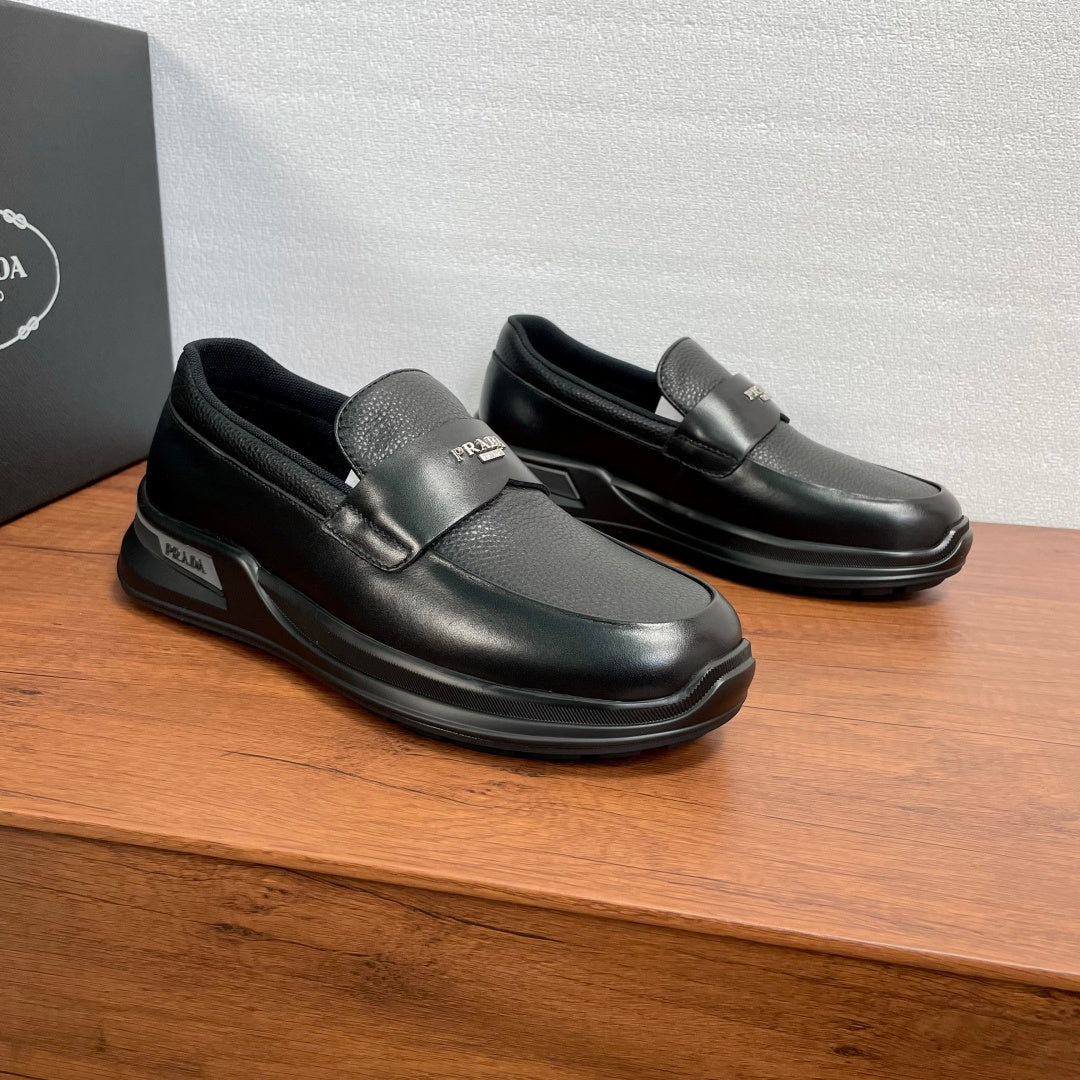 Prada unisex black leather loafers with strap detail and chunky rubber sole