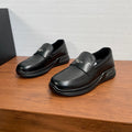 Prada unisex black leather loafers with strap and logo detail, slip-on style